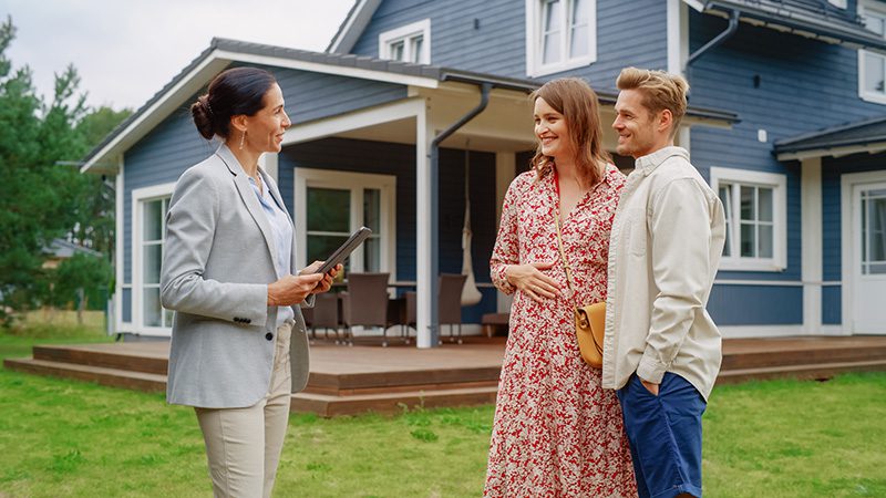 Property Manager showing a couple an available home