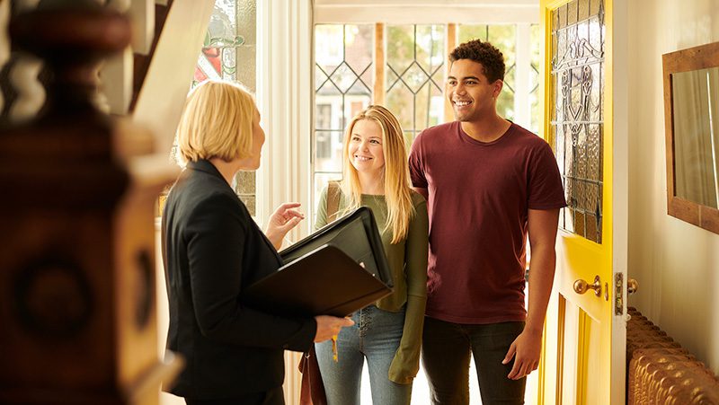 Renter's agent showing property to young couple